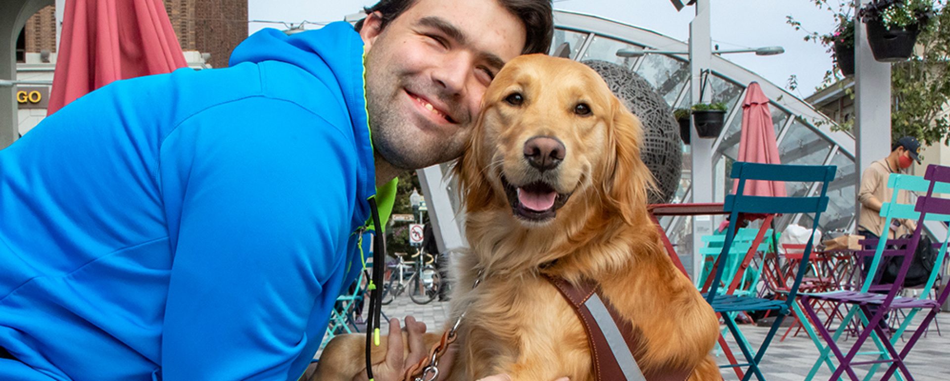 A man and a Golden Retriever guide dog